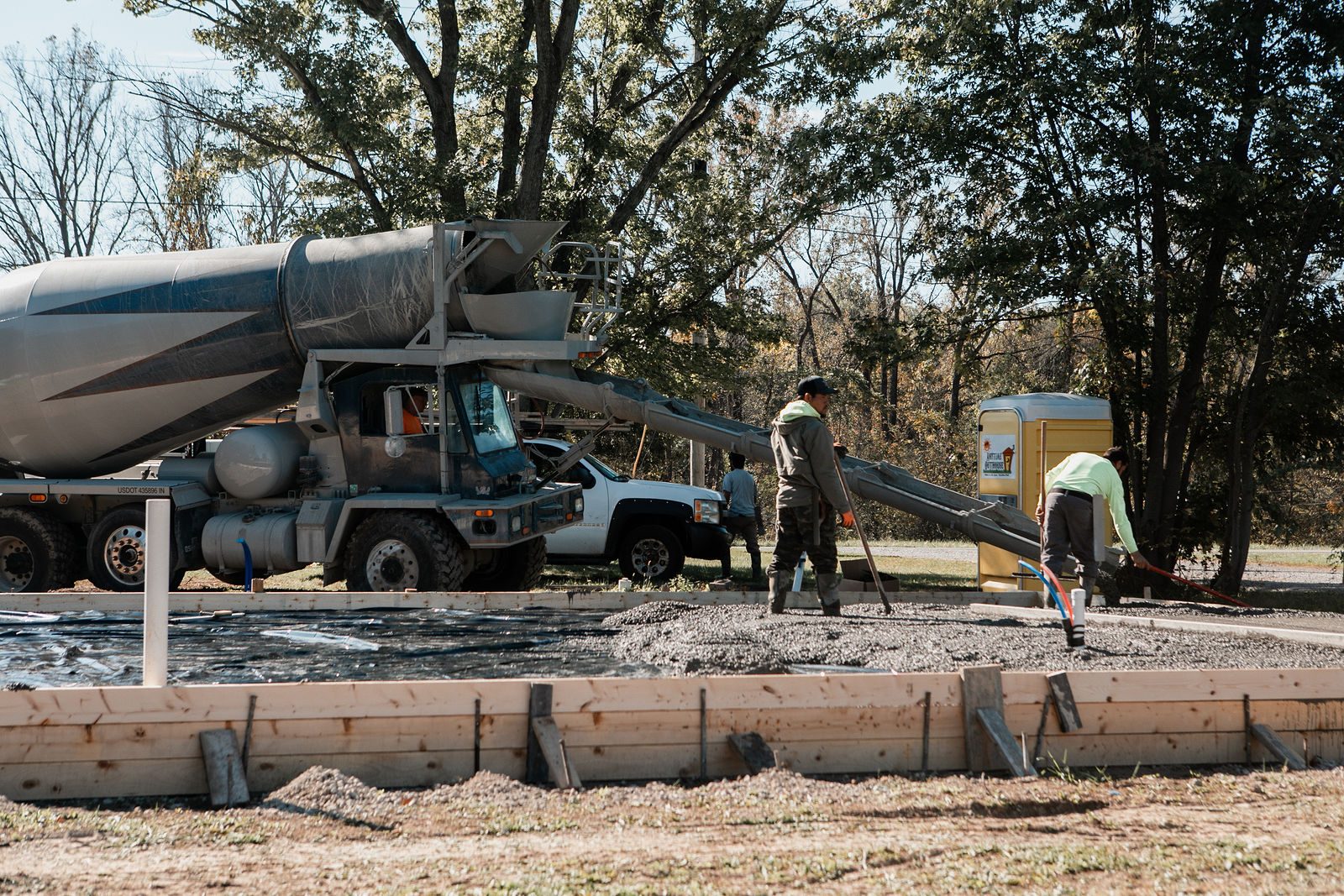 Concrete truck pouring the foundation slab of a ground-up home in the Indianapolis area