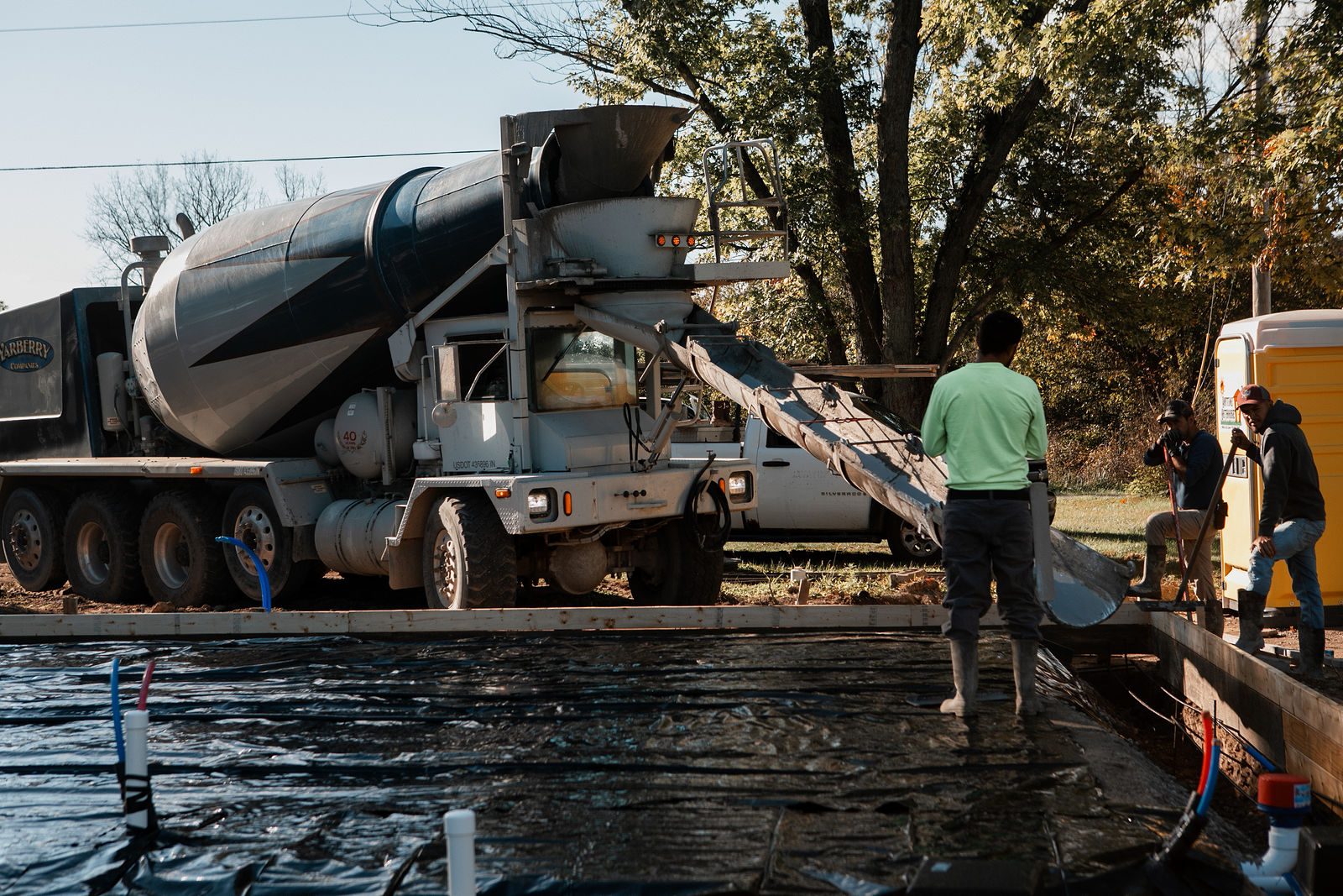 Crew pouring the concrete slab for a new design-build home in the Indianapolis area