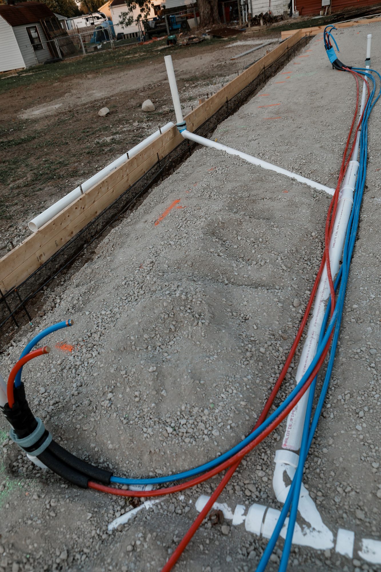Under-slab plumbing and water lines roughed in for a new home in the Indianapolis area