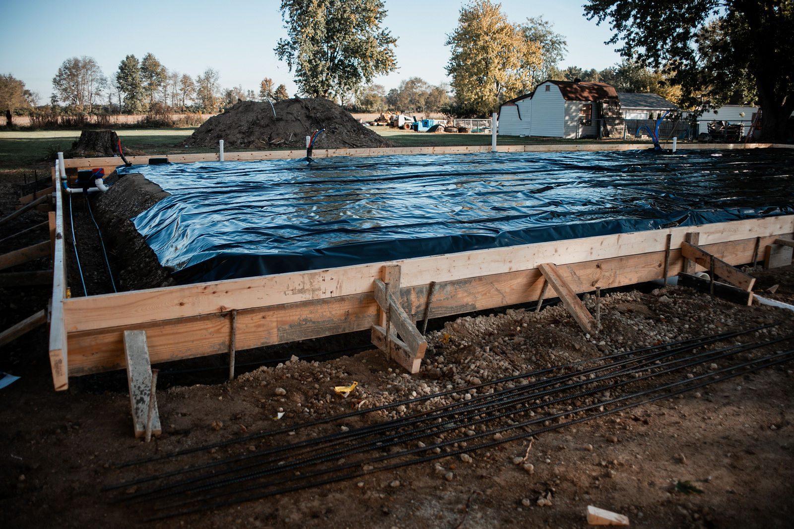 Vapor barrier laid before the slab pour on a new design-build home in the Indianapolis area
